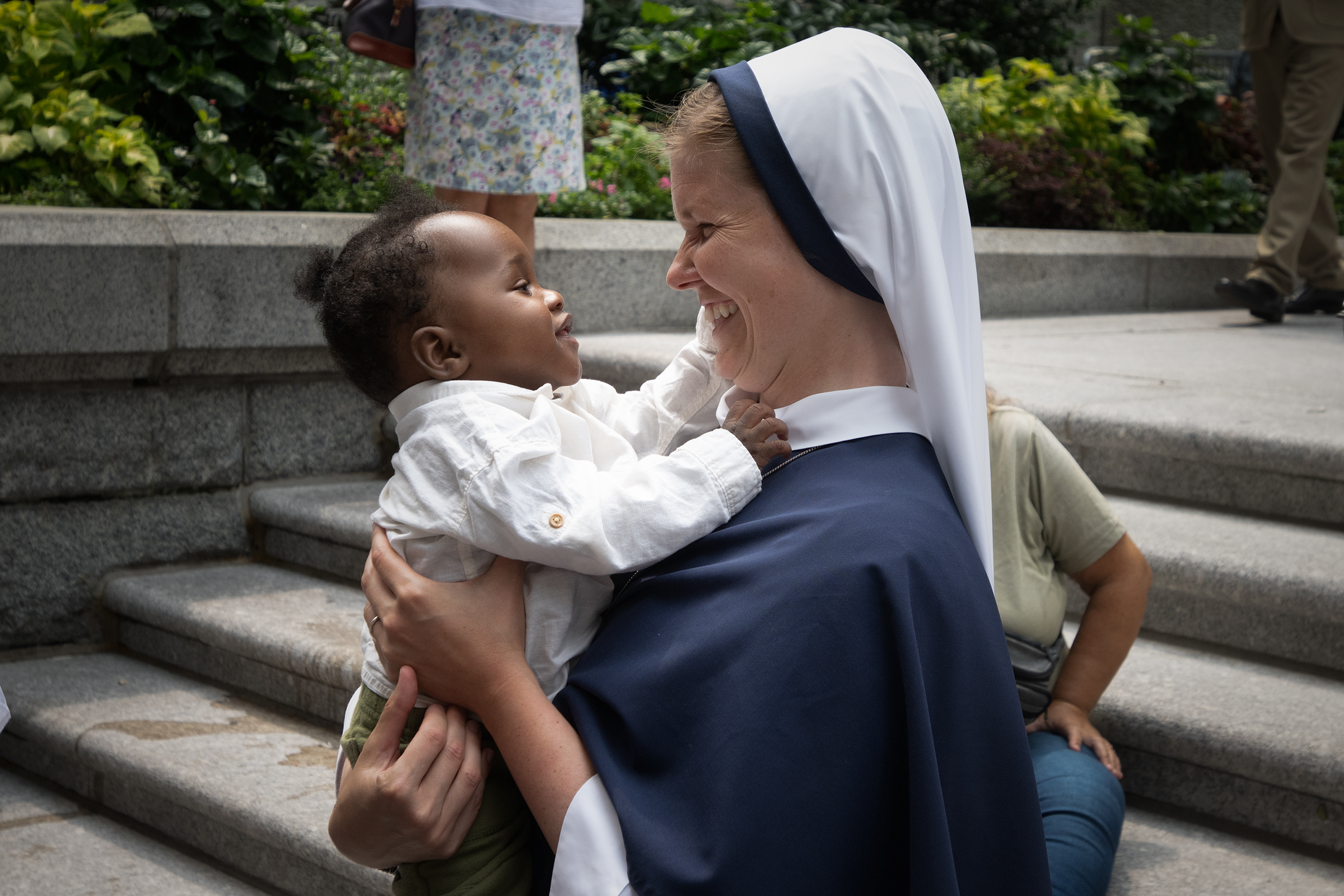 A Sister shares a joyful moment with a young child