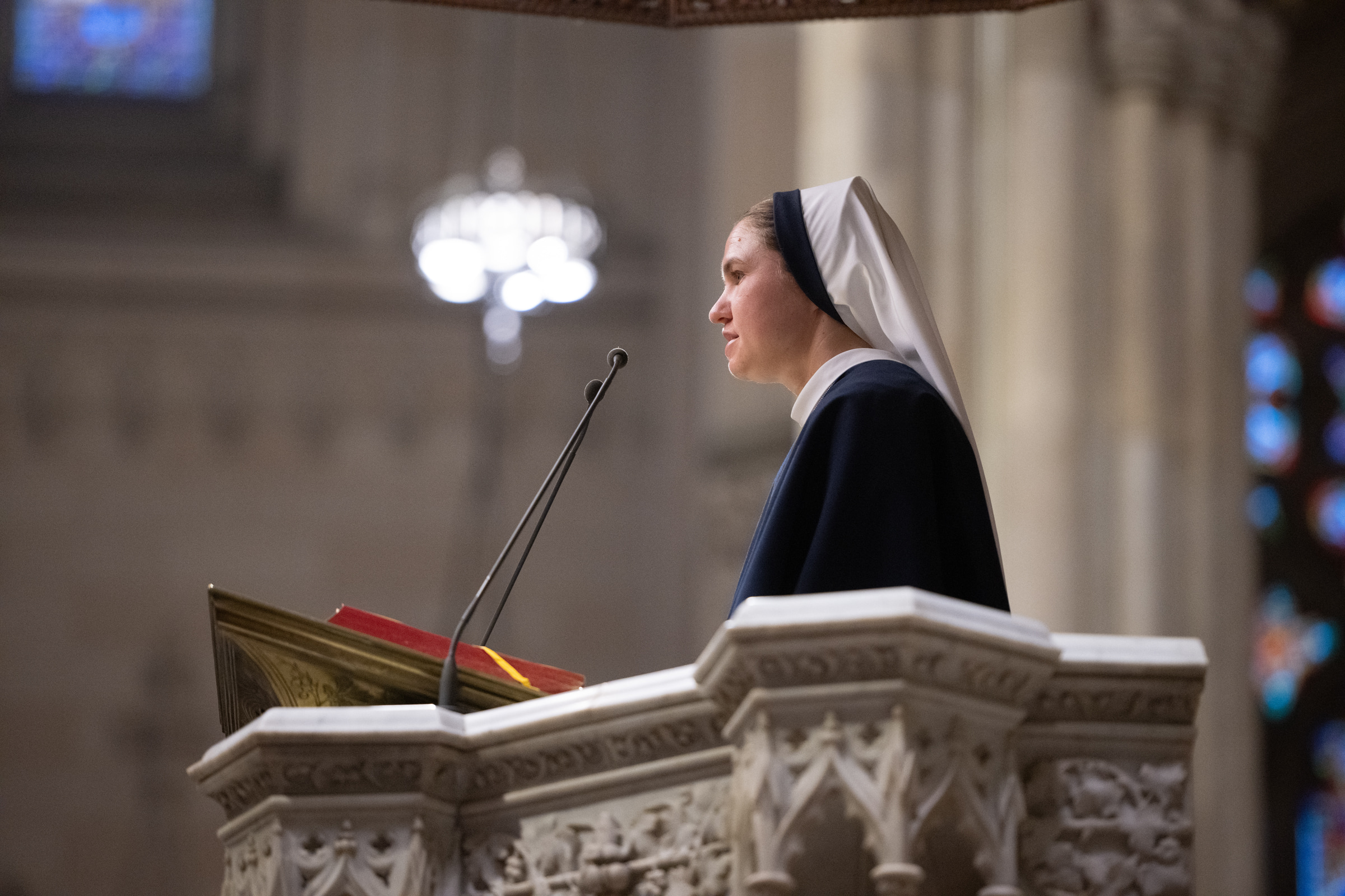 Sister Beata Victoria, S.V., proclaims a reading from the cathedral ambo.
