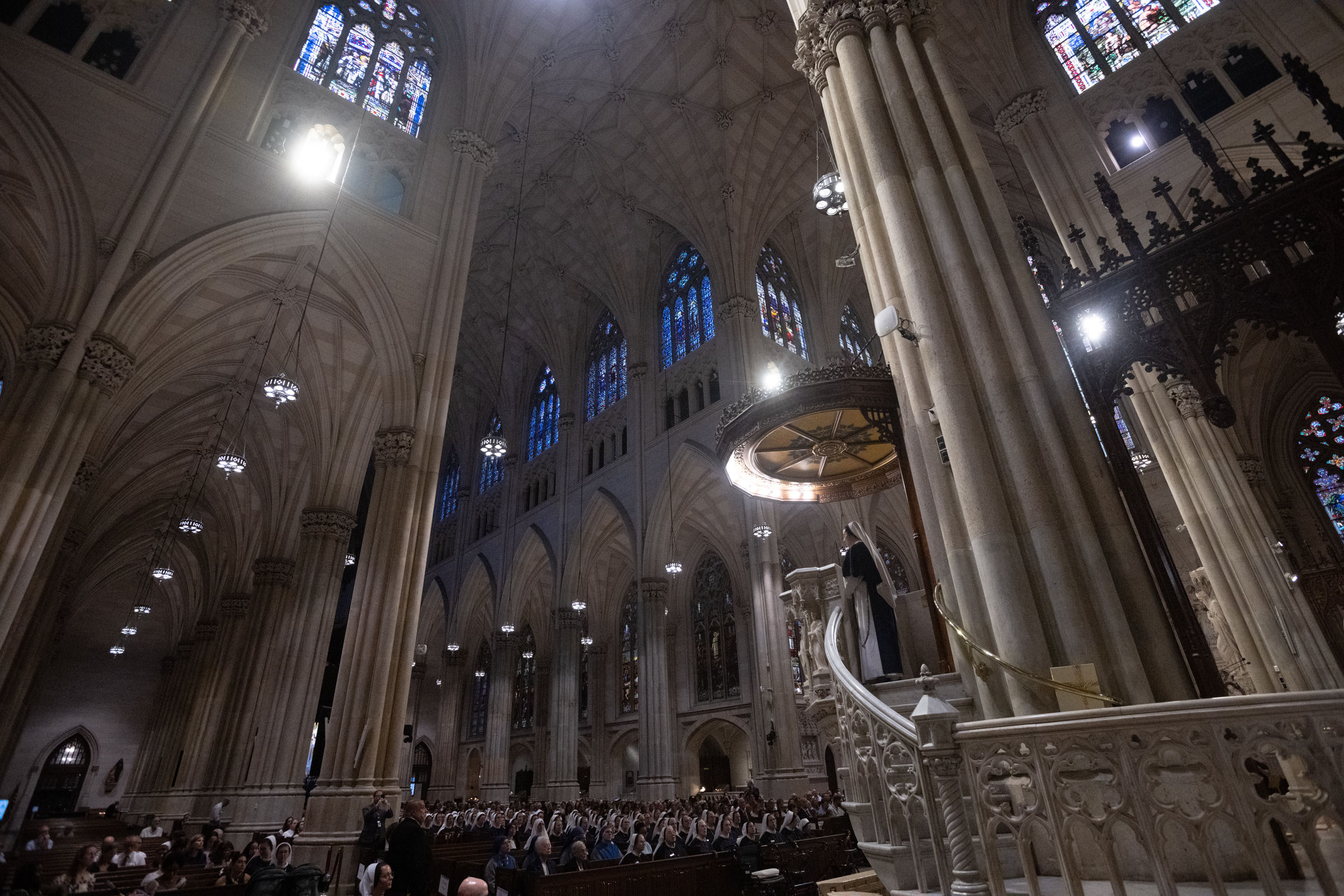 Sister Beata Victoria, S.V., proclaims a reading from the elevated cathedral ambo.