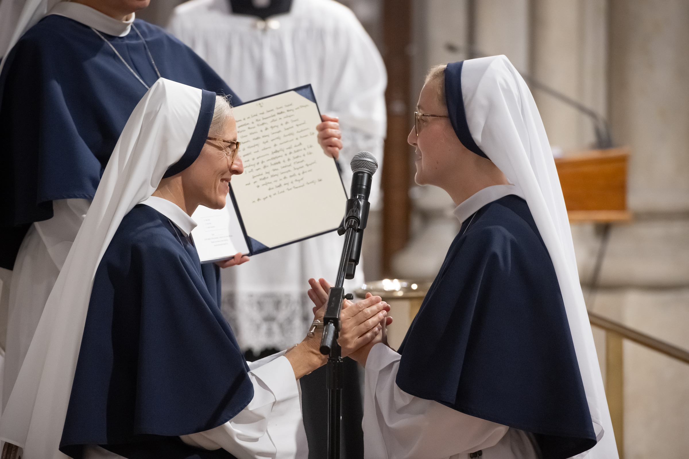 Sister Elena Marie, S.V., smiles as she professes her vows before Mother Mary Concepta.