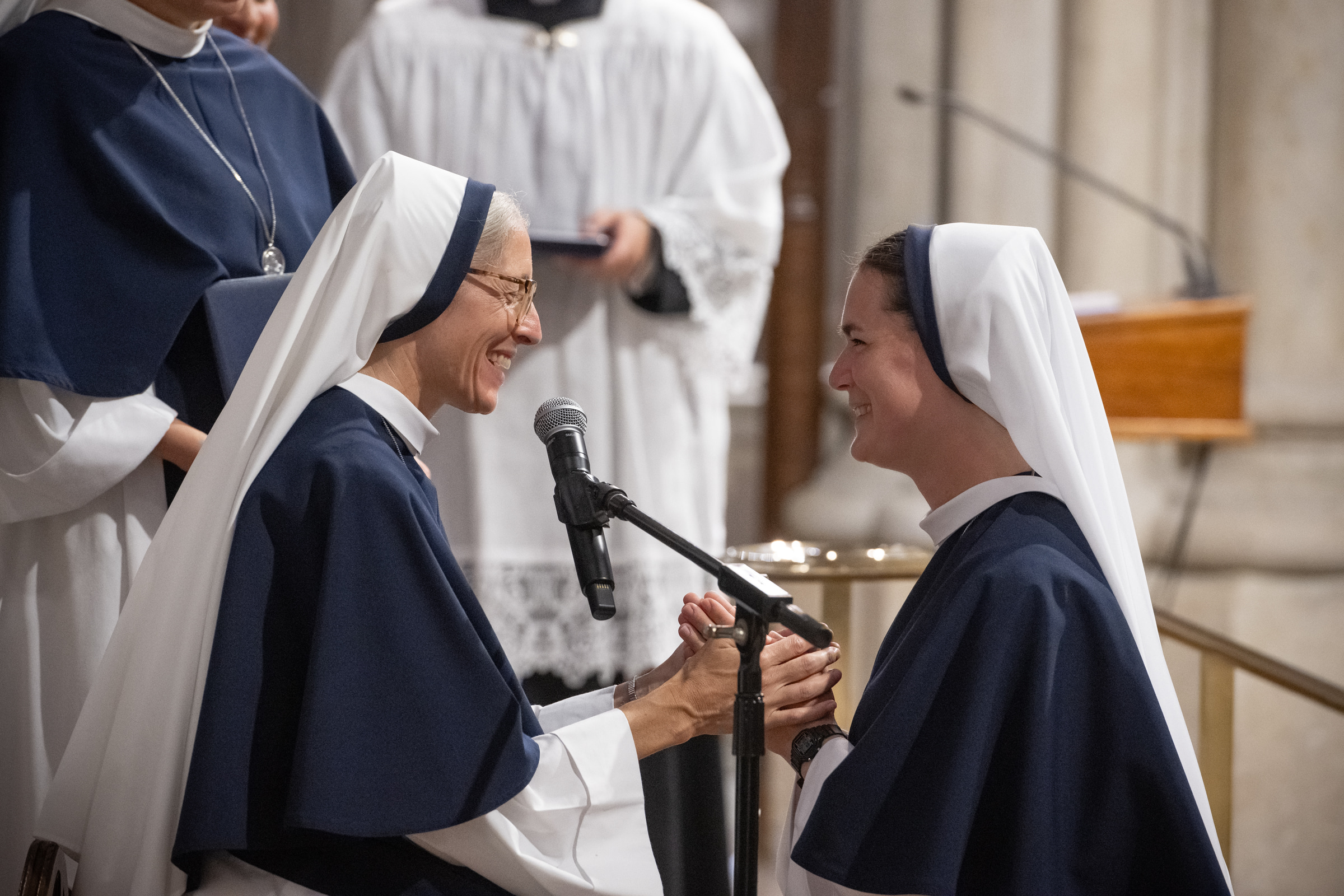 Sister Maria Annunciata, S.V., smiles as she professes her vows before Mother Mary Concepta.