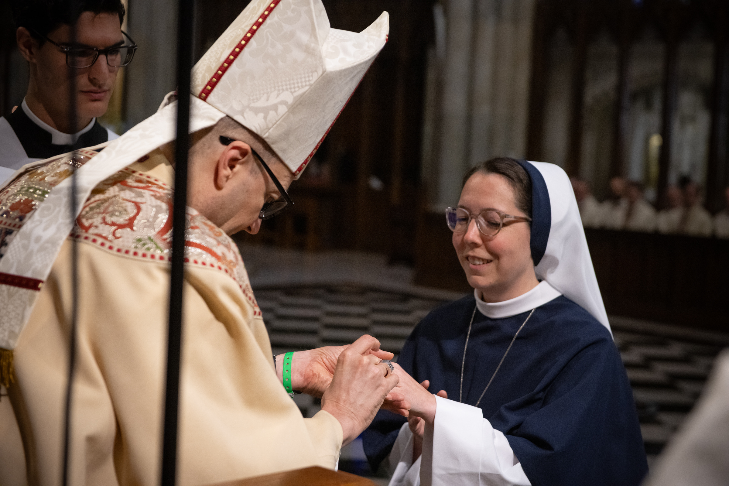 Archbishop Hicks places the profession ring on Sister Eden Marie, S.V.
