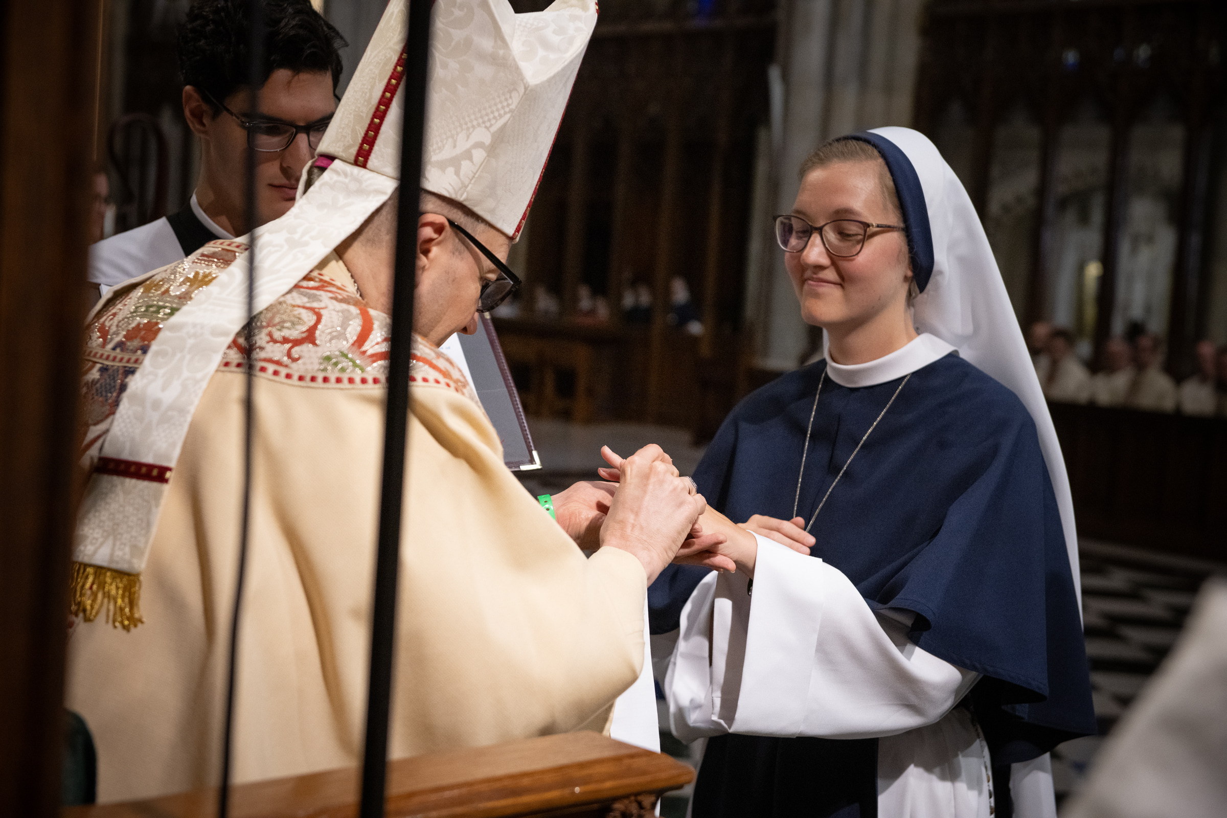 Archbishop Hicks places the profession ring on Sister Elena Marie, S.V.