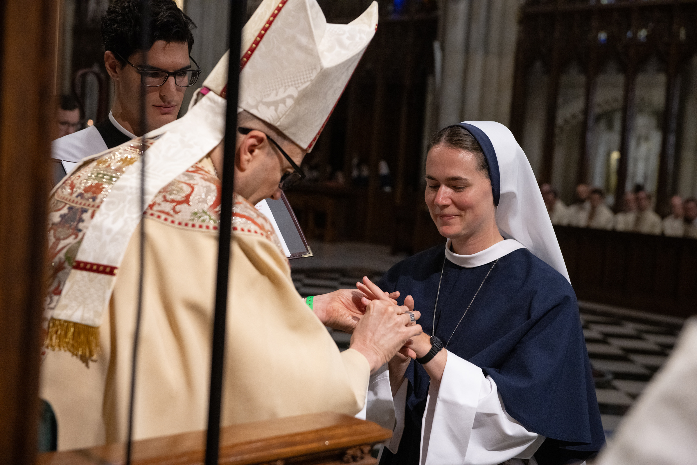 Archbishop Hicks places the profession ring on Sister Maria Annunciata, S.V.