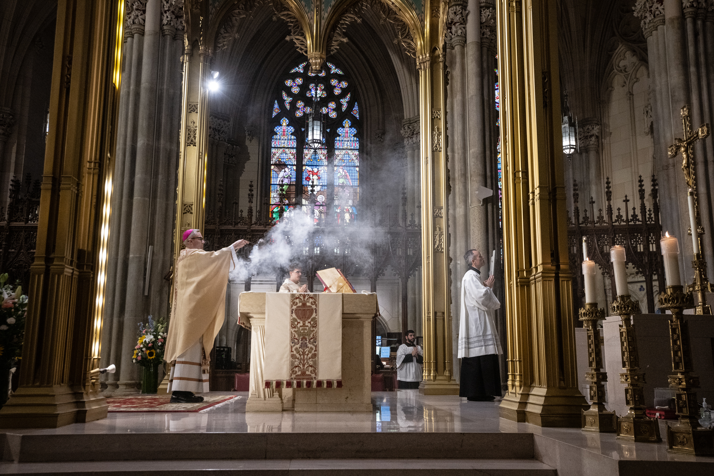 Archbishop Hicks incenses the altar beneath the cathedral’s gilded arches.