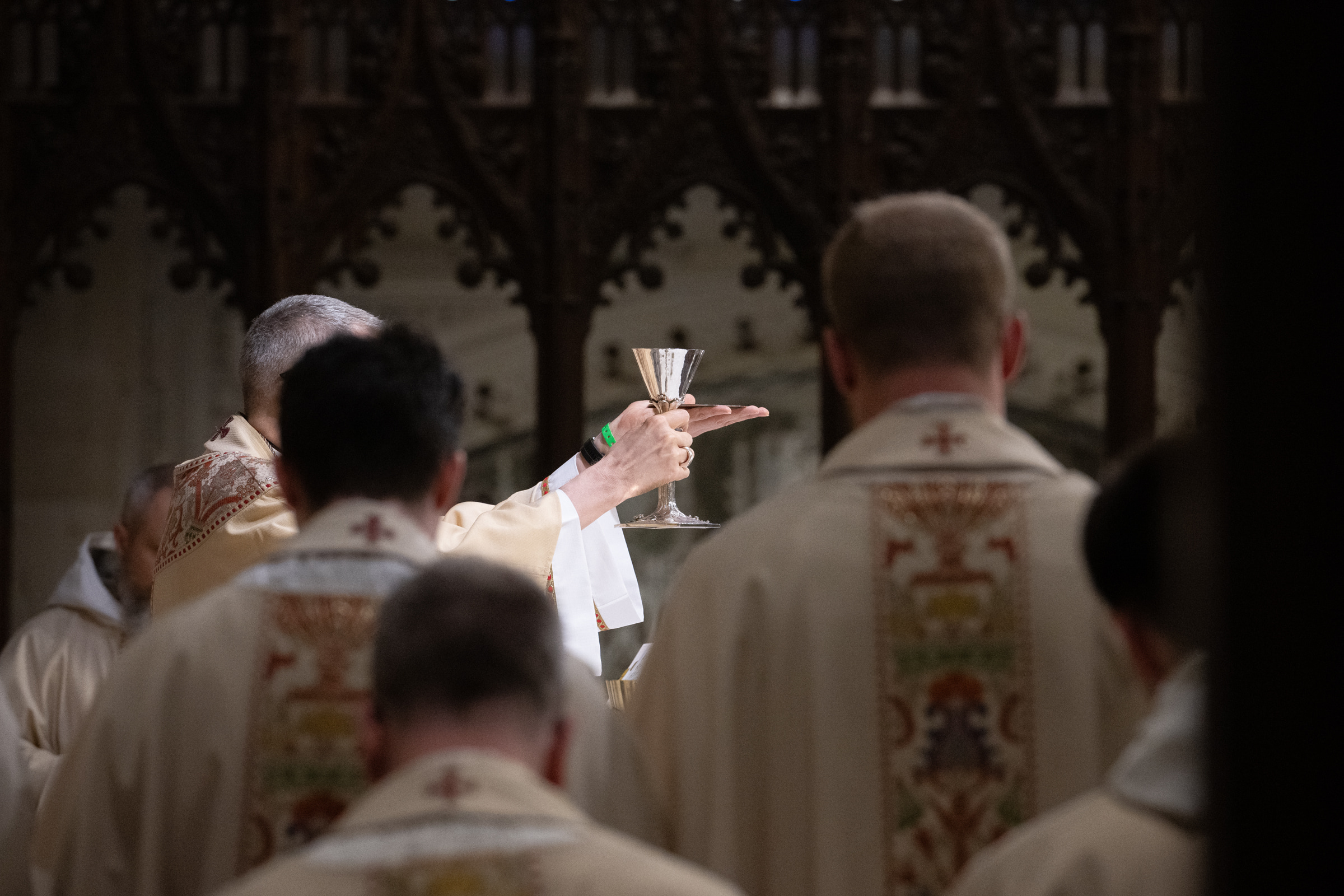 Archbishop Hicks elevates the chalice during the Eucharistic Prayer.
